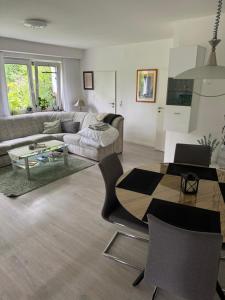 a living room with a couch and a table at Ferienwohnung am Waldesrand in Blomberg