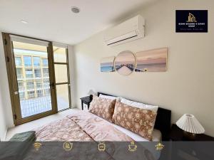 a bedroom with a bed and a window at C04-Summerfield Stylish 2BR Apart, Mountain view in Weston Creek