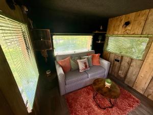 a living room with a couch and a table at Nesta's Nook in Llandovery +33 photos