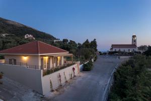 a house on a street with a road at Anthos Villa in Kardhakáta