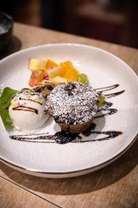 a white plate of food on a table at NOVA Motel in Międzyrzecz +22 photos