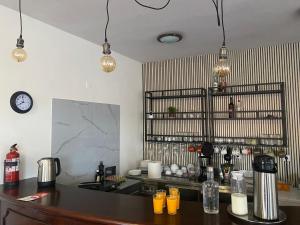a kitchen with a counter and a counter top with drinks at Casa De Cha Prazeres in Prazeres