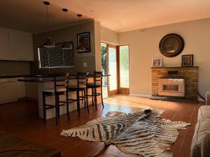 a living room with a zebra rug on the floor at Prime location in Welgemoed in Welgemoed
