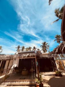 a house on the beach with palm trees at The Sanctuary in El Nido +115 photos