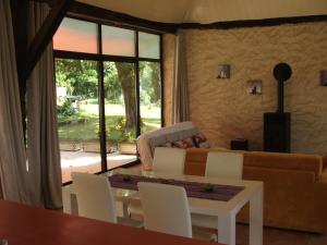 a living room with a couch and a table at La Zénitude in Les Lèches