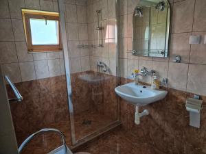 a bathroom with a shower and a sink at Nevesta hôľ pod Chopkom in Bystrá +37 photos