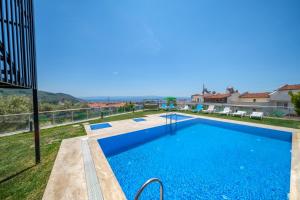 a swimming pool in a villa with a view at Ornella Butik Otel in Edremit