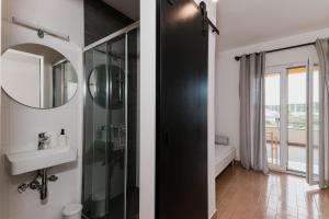 a bathroom with a shower and a sink at Babin bed&breakfast in Pirovac +69 photos