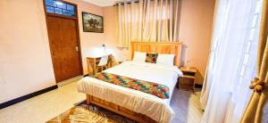 a bedroom with a bed in a room at Kiliheights Getaway in Sanya Chini Station