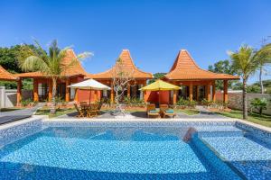 an image of a villa with a swimming pool at Wigus Villa Melasti in Ungasan