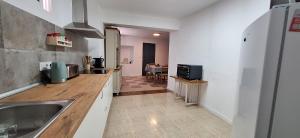 a kitchen with a sink and a counter top at Casa Ameghino in Laujar de Andarax +7 photos