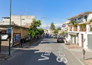 a street with a stop sign on the side of the road at Little House Forio in Forio d'Ischia +1 photo