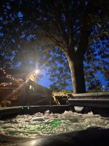 a water slide in a park at night at Casa Leone near Bruges with jacuzzi & parking in Ruddervoorde