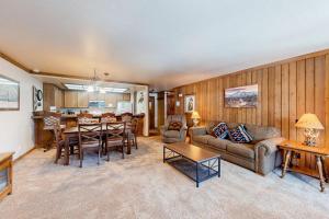 a living room with a couch and a table at Mountainback 47 in Mammoth Lakes