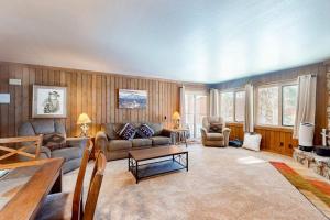 a living room with a couch and a table at Mountainback 47 in Mammoth Lakes