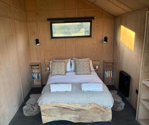 a bedroom with a bed in a small room at Ben Nevis Basecamp in Torlundy