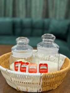 two glass containers in a basket on a table at Gulberg Greens Islamabad in Islamabad +10 photos