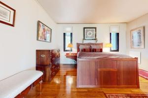 a bedroom with a large bed and a wooden dresser at The Diggins in Jackson