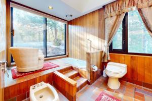 a bathroom with a toilet and a sink at The Diggins in Jackson +54 photos