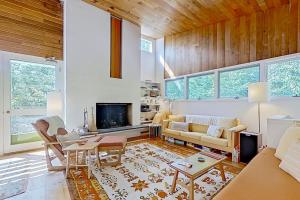 a living room with a couch and a table at Base Camp 32 in Jackson