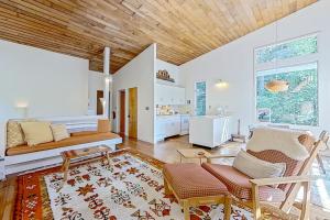 a living room with a couch and a bed at Base Camp 32 in Jackson