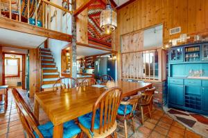 a dining room with a wooden table and chairs at Audrey Leigh in Newburyport