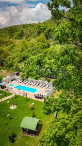 an aerial view of a resort with a swimming pool at VALEA MAGURII in Novaci-Străini