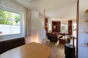 a living room with a table and a couch at Ferienhaus Bergblick in Redlham