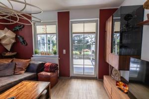 a living room with a couch and a table at Ferienhaus Bergblick in Redlham