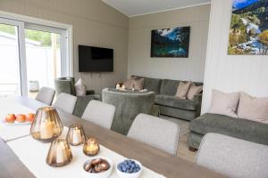 a living room with a couch and a table at Olden Fjord View in Olden