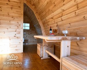 a log cabin with a tasting table in it at KOPA CABINS seaside stay in Nida