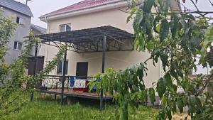 a view of a house with a pergola at Minsu in Mamyr