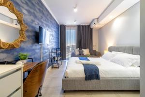 a bedroom with two beds and a mirror at Lux @ Ellipse Galelileo in Midrand