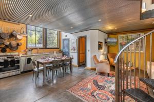 a kitchen and dining room with a table and chairs at Galena Chalet - Valley View 1 Br 1 Ba 2 Half Ba Sleeps 4 in Telluride