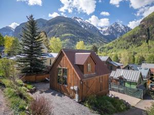 a home with mountains in the background at Galena Chalet - Valley View 1 Br 1 Ba 2 Half Ba Sleeps 4 in Telluride