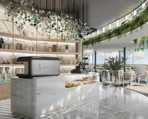 a store lobby with a counter with plants on the wall at Lux @ Ellipse Galelileo in Midrand