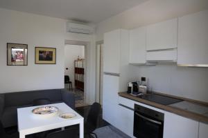a small kitchen with a table and a counter top at La Genziana - villino con parcheggio privato in Popoli
