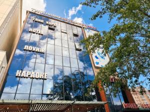 a building with the hilton hong kong reflected in the windows at Twin Horse Hotel in Ulaanbaatar