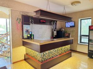 a bar in a restaurant with a counter at Twin Horse Hotel in Ulaanbaatar