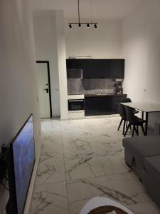 a living room with a couch and a table at Erna Apartment in Golem