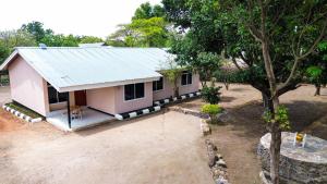 an overhead view of a small pink house at Kiliheights Getaway in Sanya Chini Station