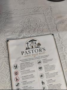a menu for a restaurant on a table at A Great Guest House Grootfontein in Groutfontein