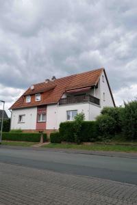a large white house with a red roof at Landhaus Stümpelstal in Marburg an der Lahn