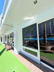 a large window on a house with a patio at Shell Residences Condotel near Mall of Asia - Aiza's Place in Manila