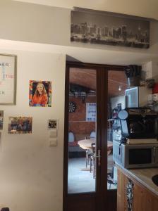 a kitchen with a door leading to a dining room at Fab's Home in Oust