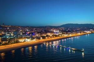 a view of a beach with a city at night at Pereira Samsun in Samsun