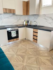 a kitchen with a stove and a counter top at Essenza di Mare Luxury B&B in Torre dell'Orso