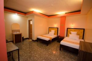 Postel nebo postele na pokoji v ubytování RSG Microhotel