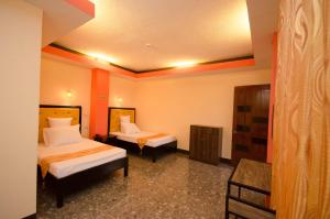 A bed or beds in a room at RSG Microhotel