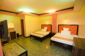 Postel nebo postele na pokoji v ubytování RSG Microhotel